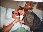 Paul in his hospital bed having a cup of coffee with his wife