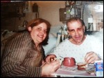 Paul in his hospital bed eating with his wife
