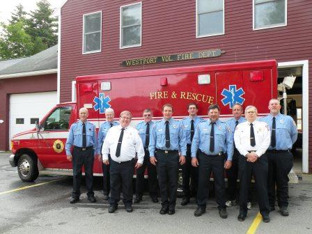 Westport Volunteer Fire Department in front of rescue vehicle